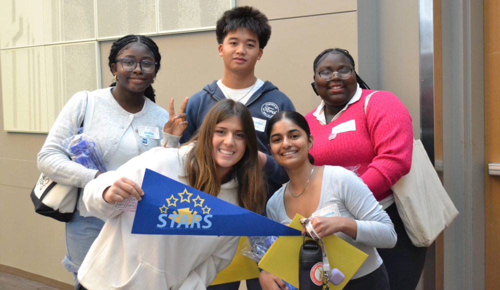 Group of five CSIB students smiling and posing for a picture.